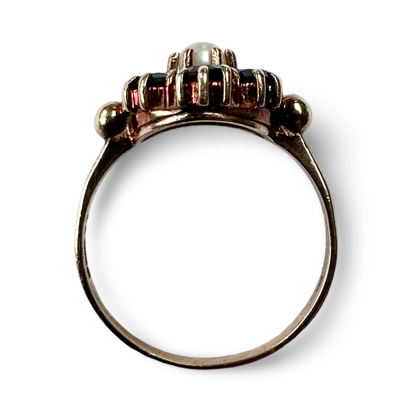 Side profile of vintage 9ct gold pearl and garnet cluster ring showing setting height