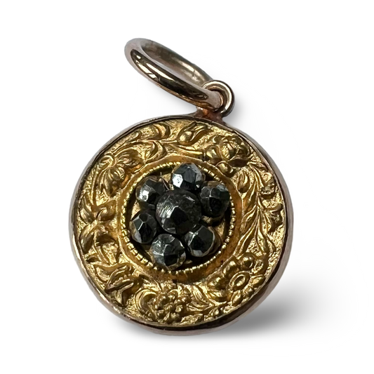 Victorian gold floral pendant with central cut steel daisy.