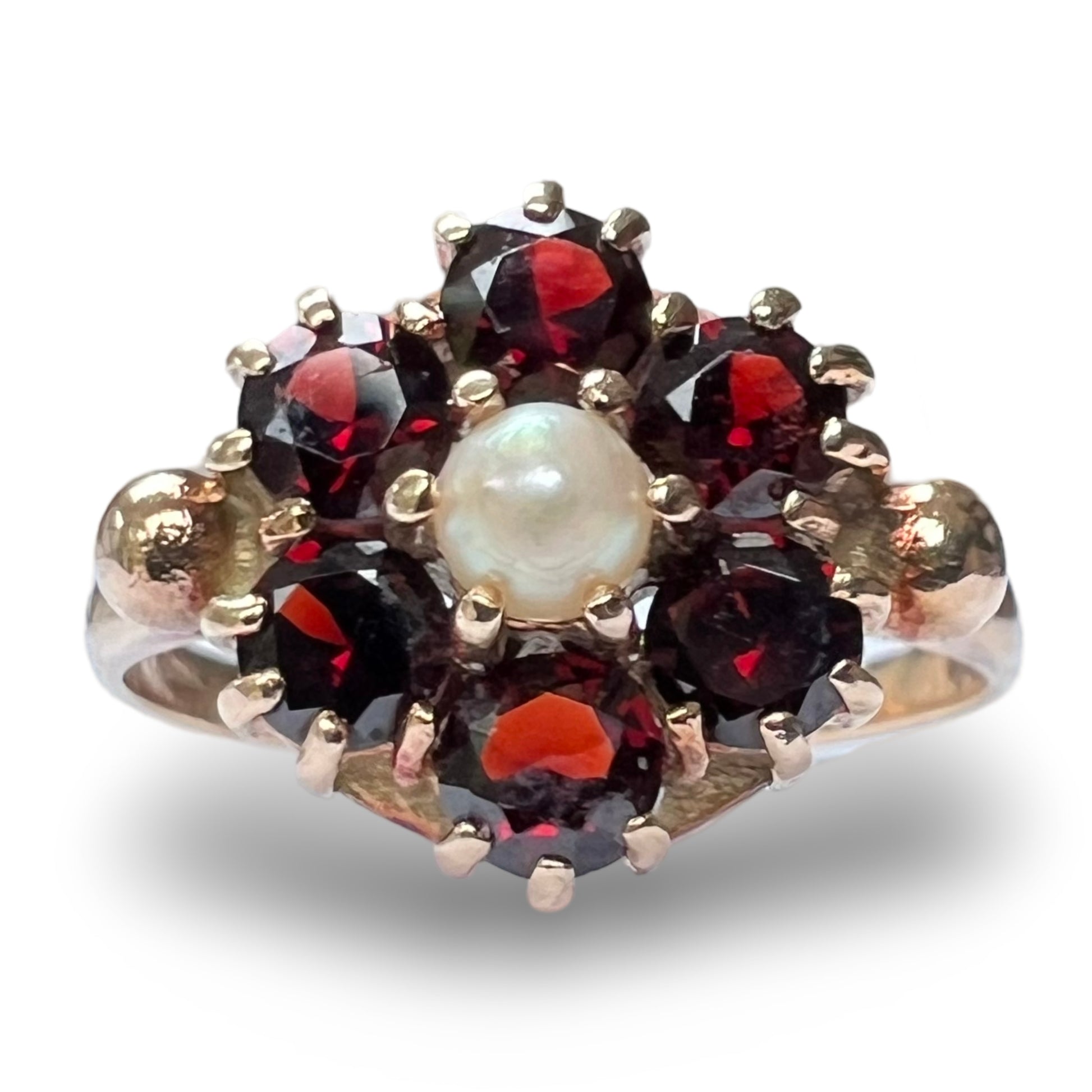 Front view of vintage 9ct gold cluster ring featuring a central pearl surrounded by garnets